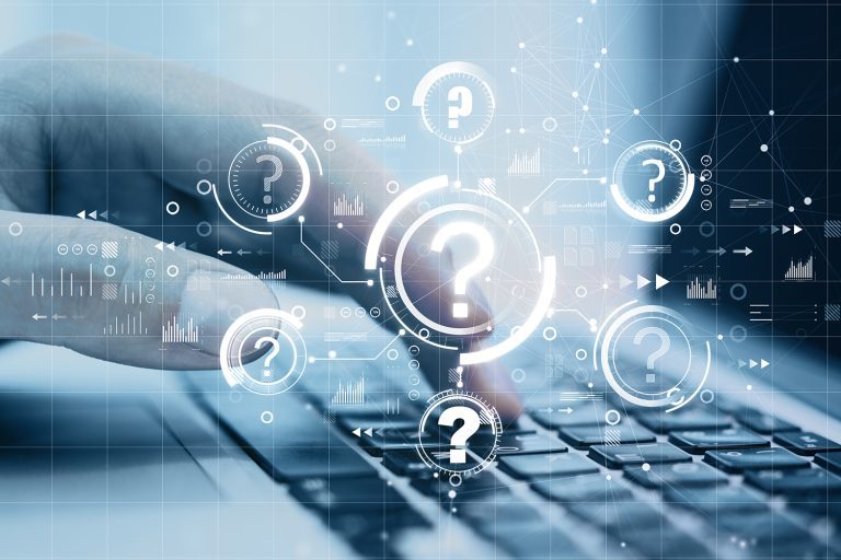 A close-up of a person typing on a laptop with a graphic overlay of question marks that appear to be part of an interface.