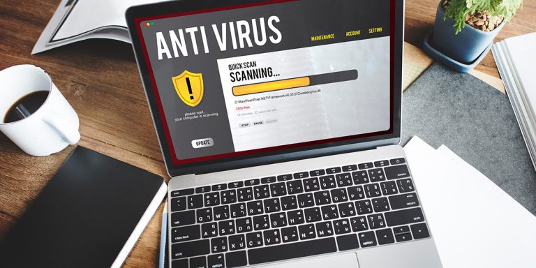 A laptop with an anti-virus program running a scan on it.