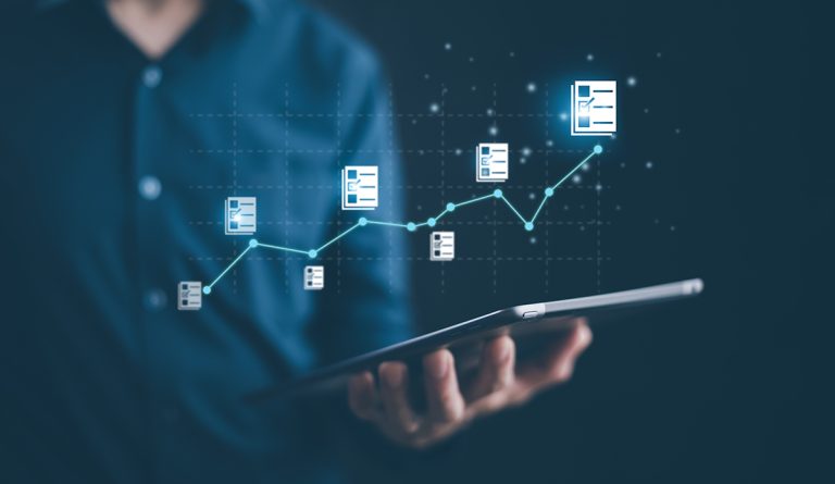 A person in a dress shirt holds a tablet with a graphic overlay of checklists moving along an increasing graph line.
