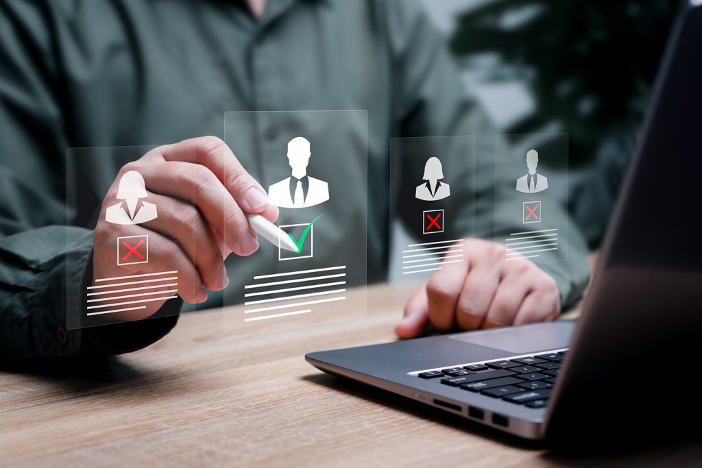 A man holding a stylus points at superimposed representations of clients.